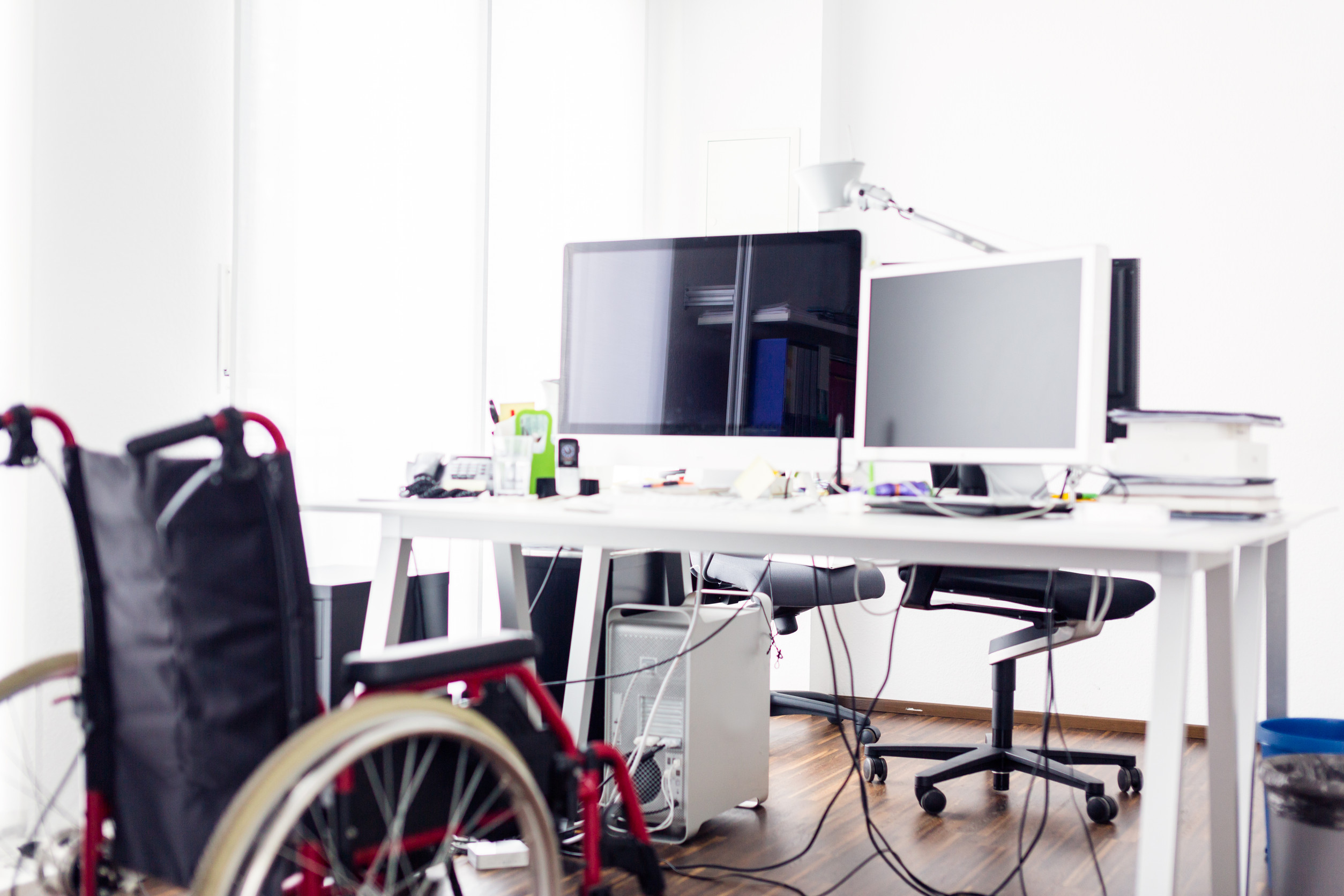 wheelchair near a computer showing accessibility