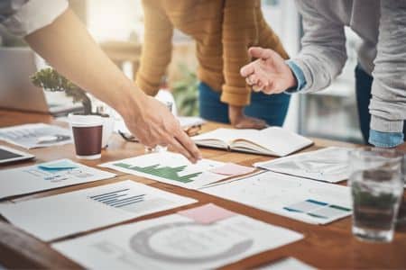 team discussing marketing strategy with charts